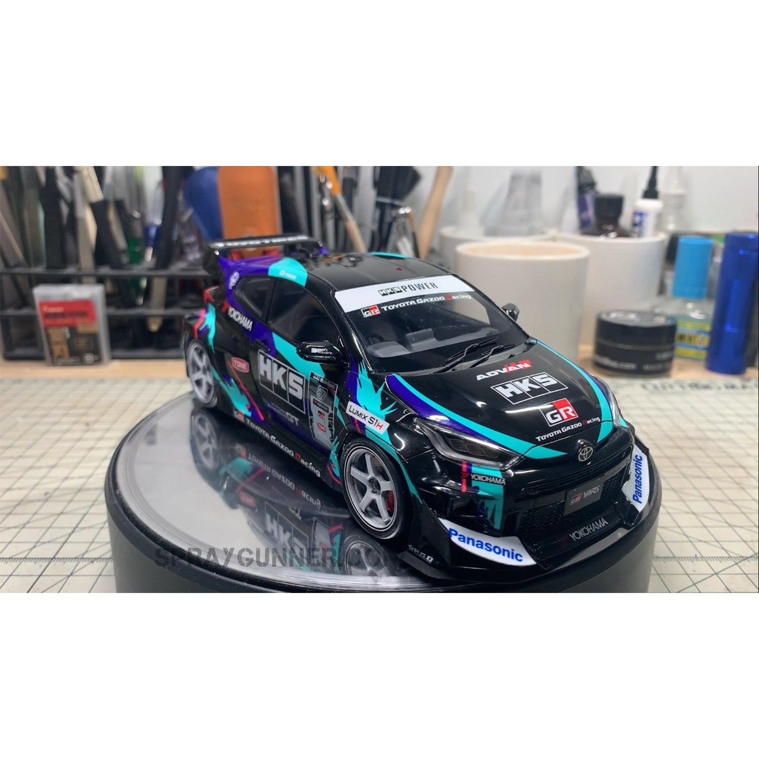 The Rocket Bunny GR Yaris (HKS) ALPHA MODEL 1/24 Scale Model Car Kit has an extremely detailed body and is liveried in HKS. Perfect for fans of scale models.