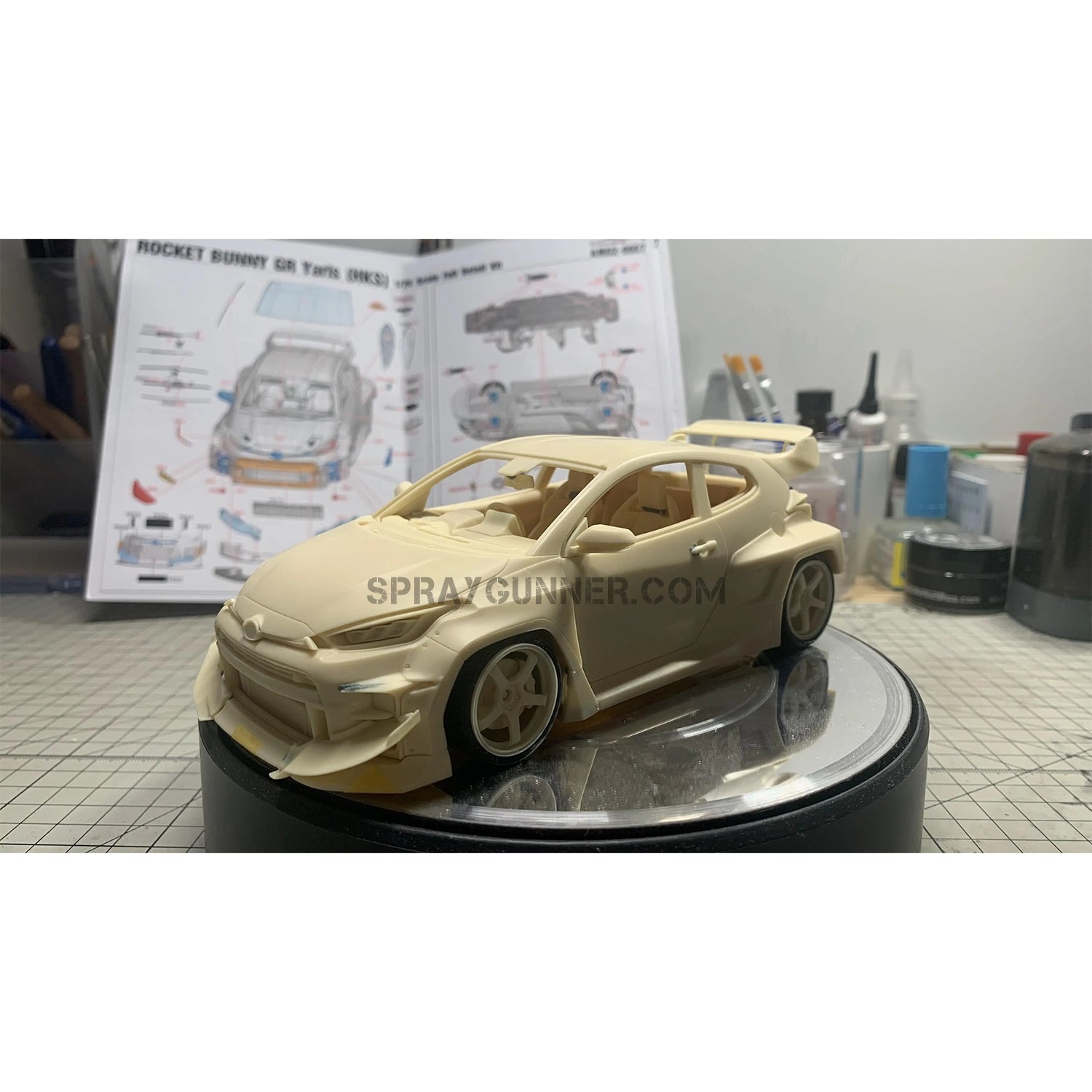 Rocket Bunny GR Yaris (HKS) ALPHA MODEL 1/24 Scale Model Car Kit with an intricately detailed body and HKS livery. Ideal for fans of scale models.