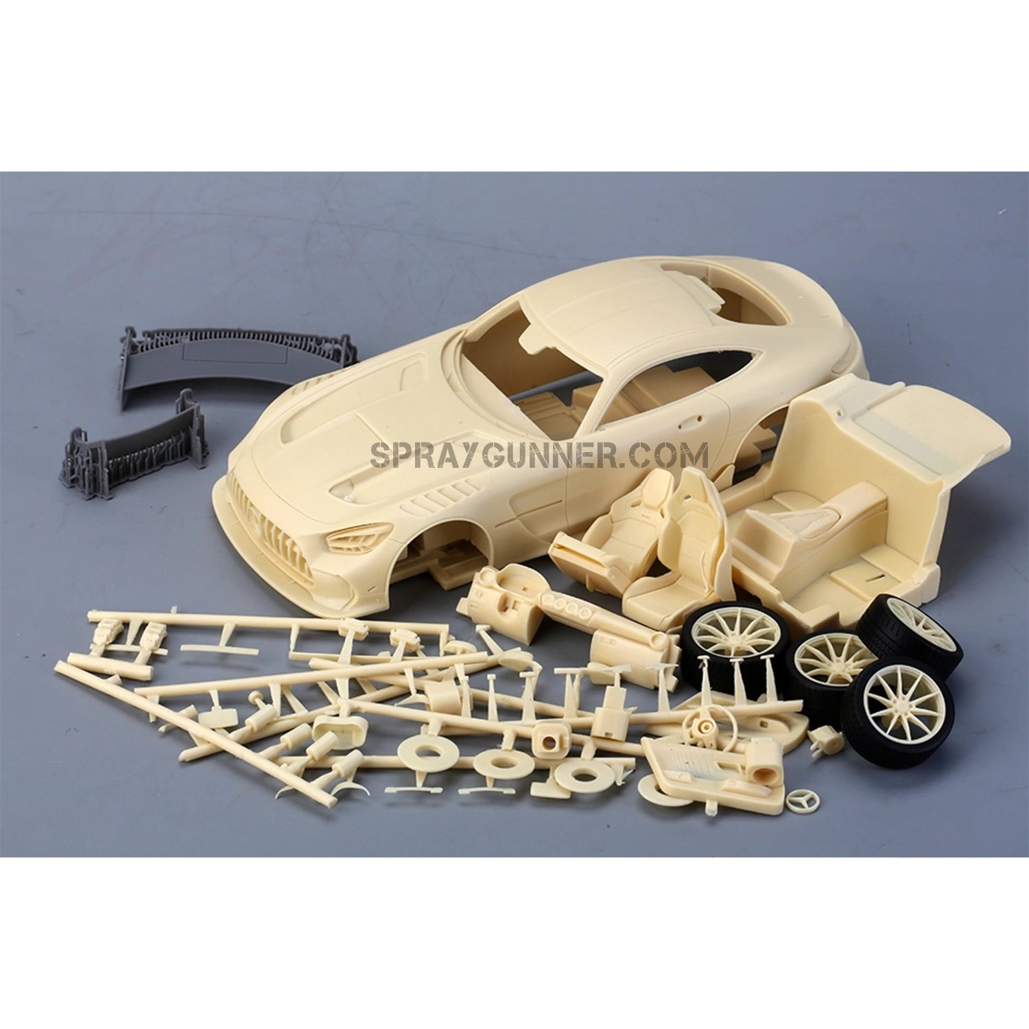 ALPHA MODEL 1/24 scale model car kit of Mercedes AMG GT Black Series, featuring unassembled resin and plastic parts for detailed model building.