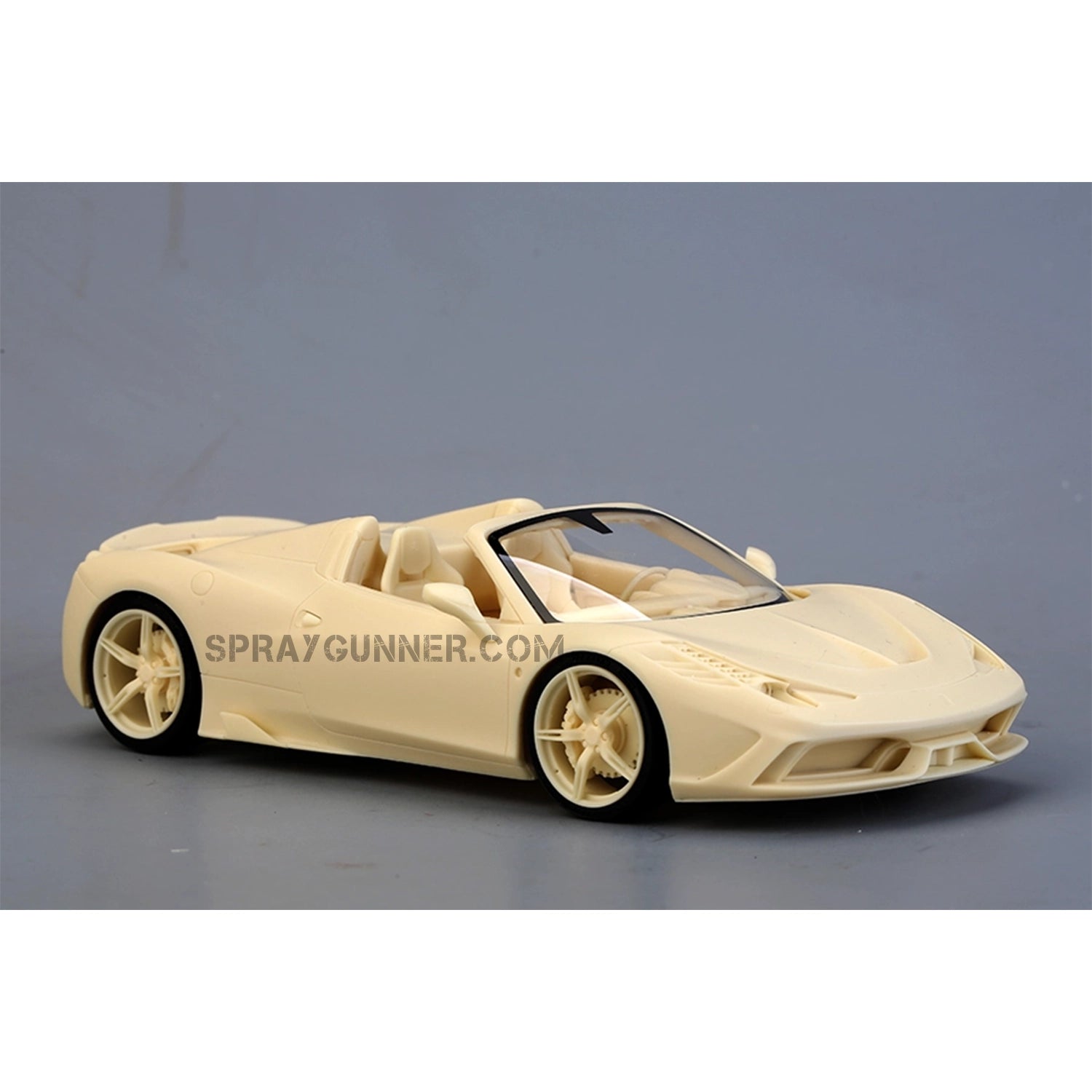 Unassembled ALPHA MODEL 1/24 scale model Ferrari 458 Speciale A in beige resin, featuring detailed bodywork and wheels.